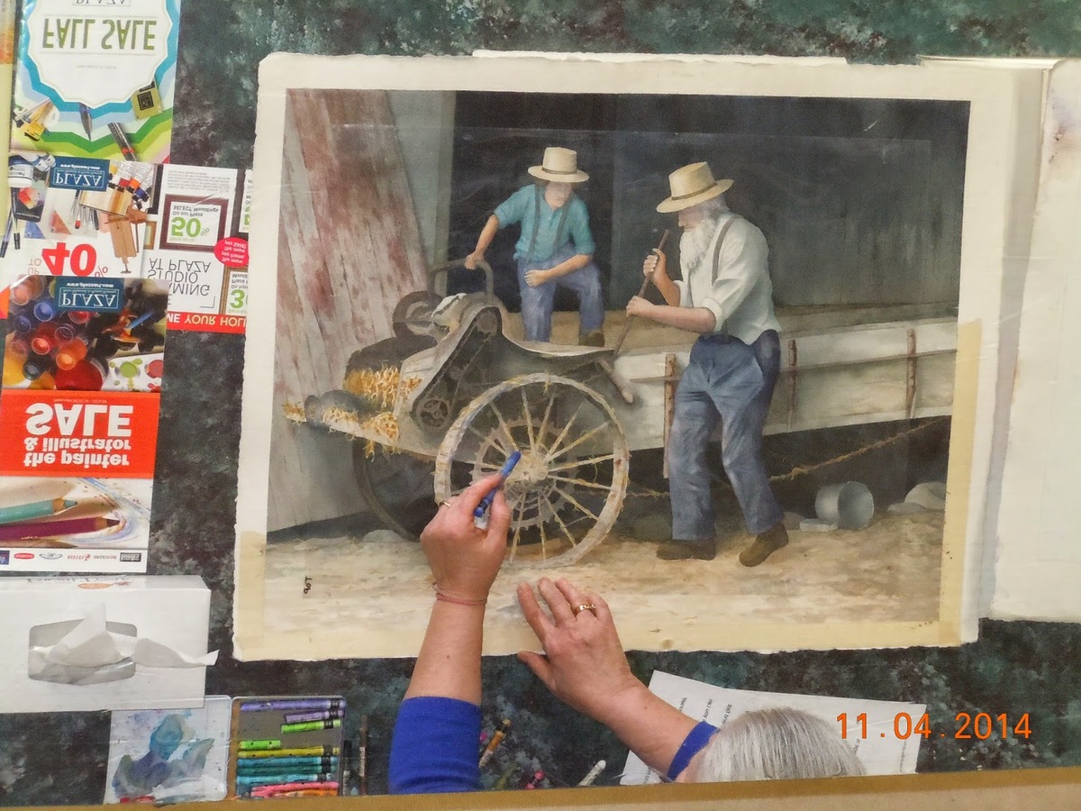 Two men tending to a wheelbarrow