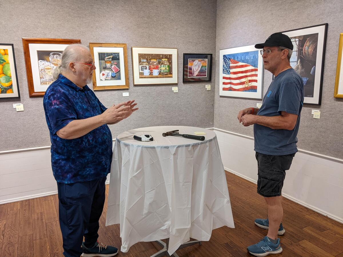 Jim Warner and Tom Schroeder hanging the exhibit.